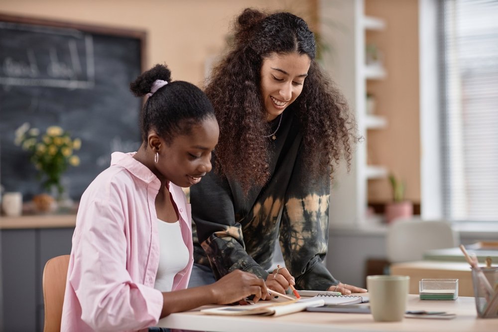 Happy student and teacher