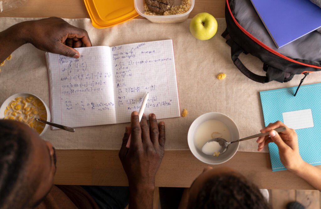 father helping daughter with homework